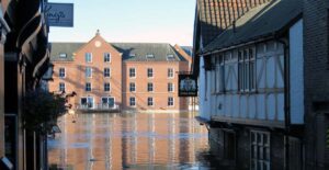 Businesses to demand urgent climate action: A flooded street in York
